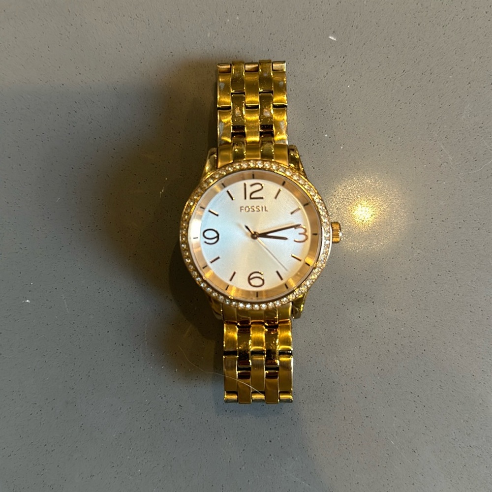 Gold fossil watch